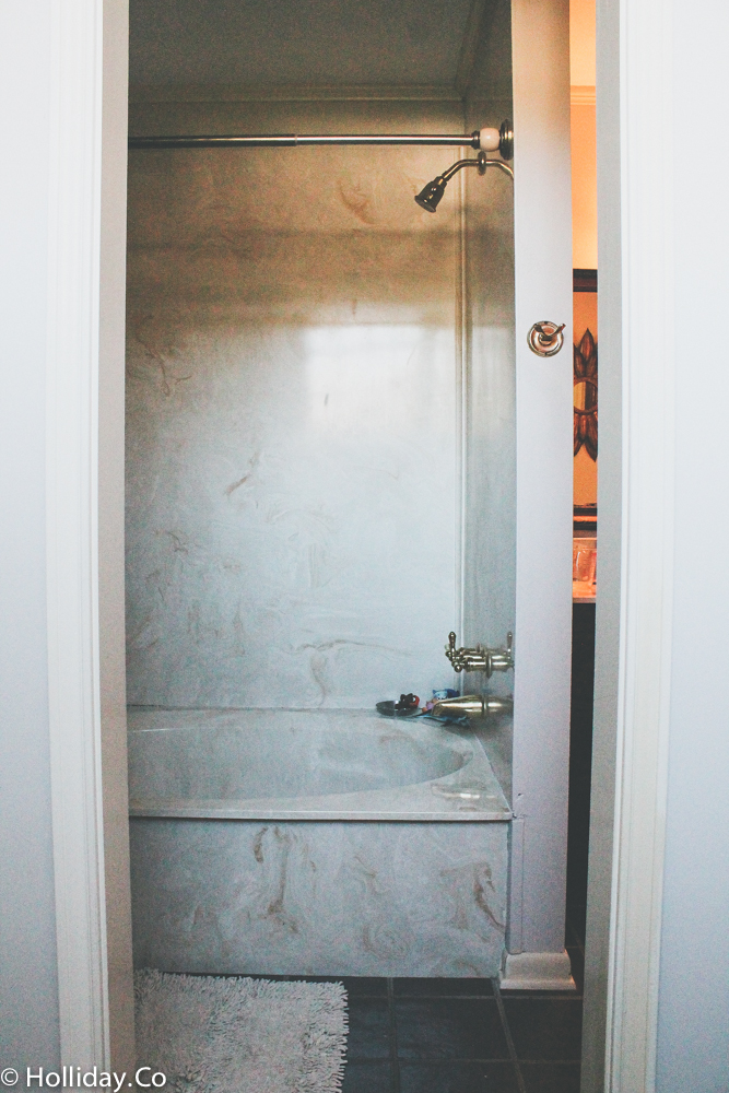 old bathroom tub - cultured marble